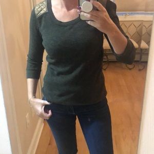 Green top with gold sparkles on shoulder and back.